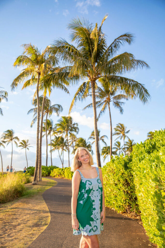 Senior girl posing confidently near lush greenery at Kapalua Beach