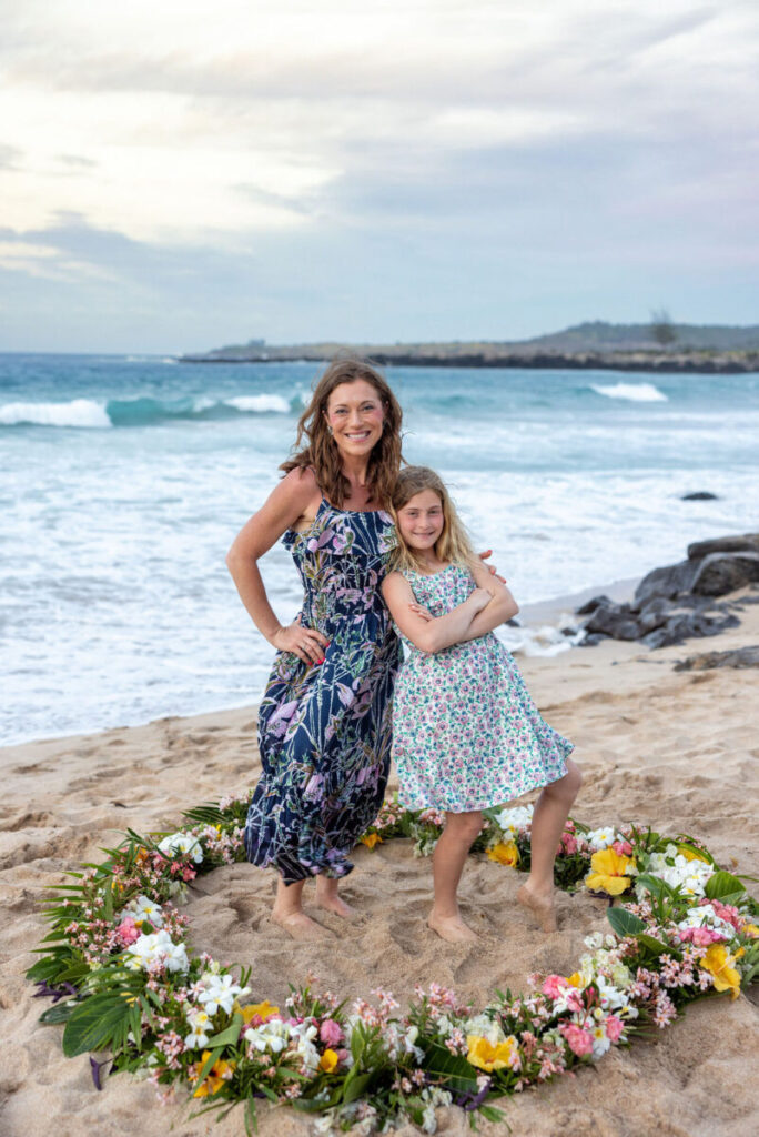 mom and daughter posing together on Maui beach