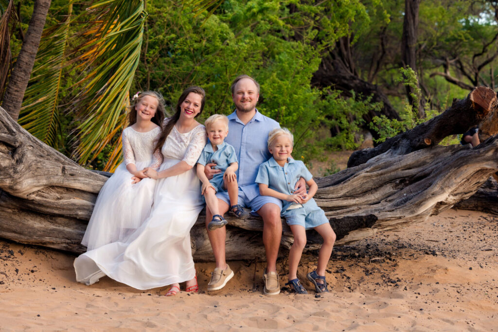 Family of five at Poʻolenalena Beach during Wailea family photography session at sunset