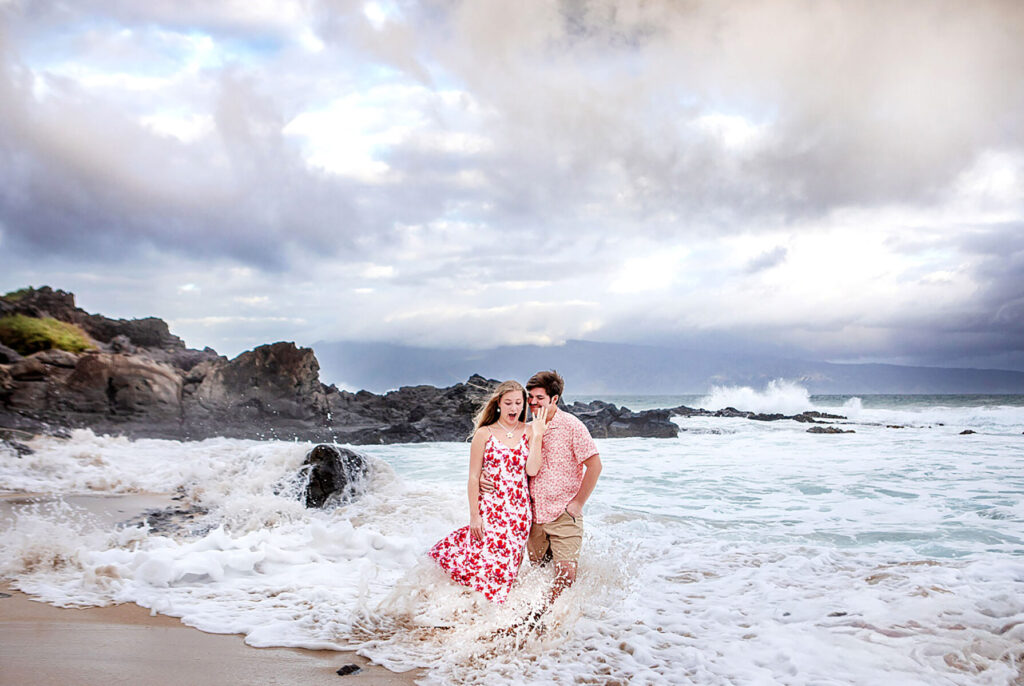 Dramatic clouds and crashing waves during sunset at Ironwoods Beach, Maui