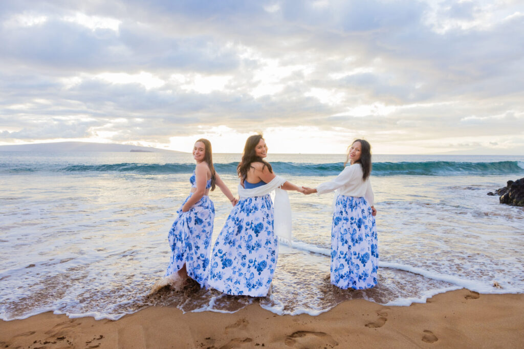 family photo at Po‘olenalena Beach with soft sunset light
