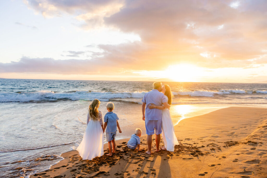 Candid family photo at Po‘olenalena Beach with soft sunset light