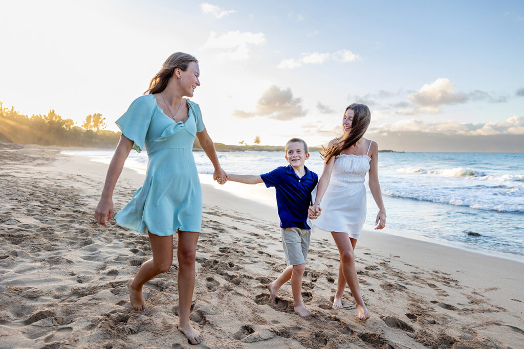 Family coordinated in soft pastel colors — what to wear for a Maui beach photoshoot with kids