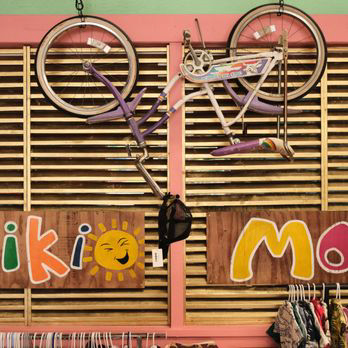 Brightly painted shop interior with hanging bicycle décor and playful wooden signs, showing the fun, creative vibe at Maui Mood Swings