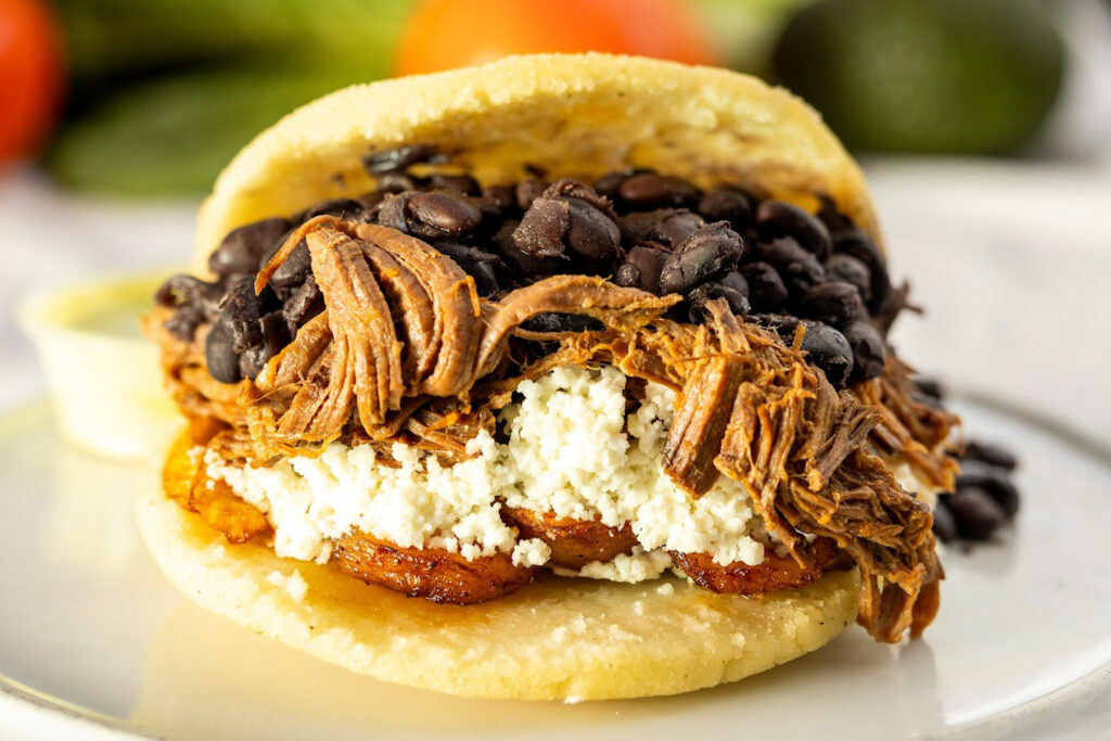 Fresh Venezuelan arepa filled with shredded beef, black beans, cheese, and plantains — Maui photographers lunch favorite at Miss Arepa in Honokowaii