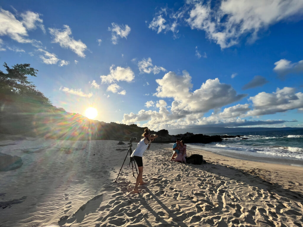 Maui Photographer Lisa from Capture Aloha Photography capturing a couple at sunset Ironwoods beach