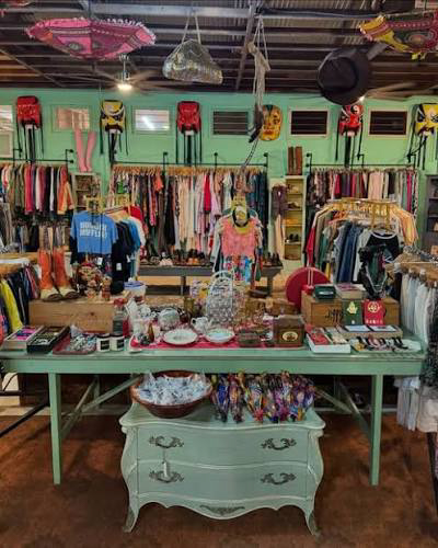 olorful thrift-store display with racks of clothes, jewelry, and vintage décor, reflecting Maui’s artistic secondhand scene at maui Mood Swings