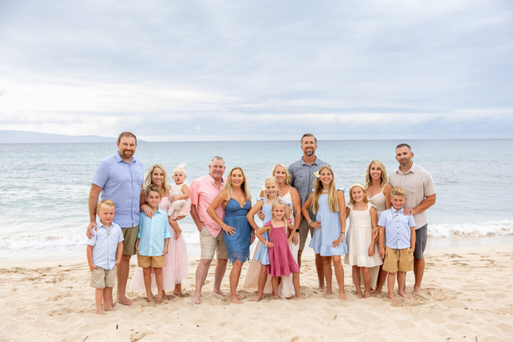 Extended family posing together along the shoreline at DT Fleming Beach, a favorite among the Top Maui Photoshoot Locations for multi-generational photos.