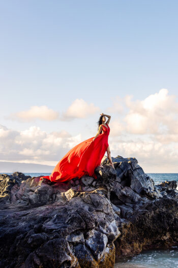 Flying dress photoshoot Maui – woman twirling on the cliffs