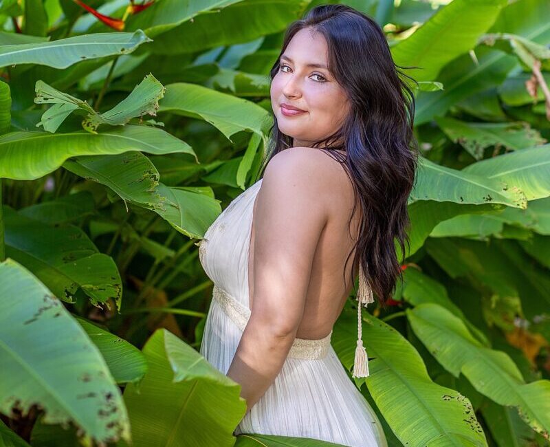 Maui graduate portraits – senior celebrating with greenery in background