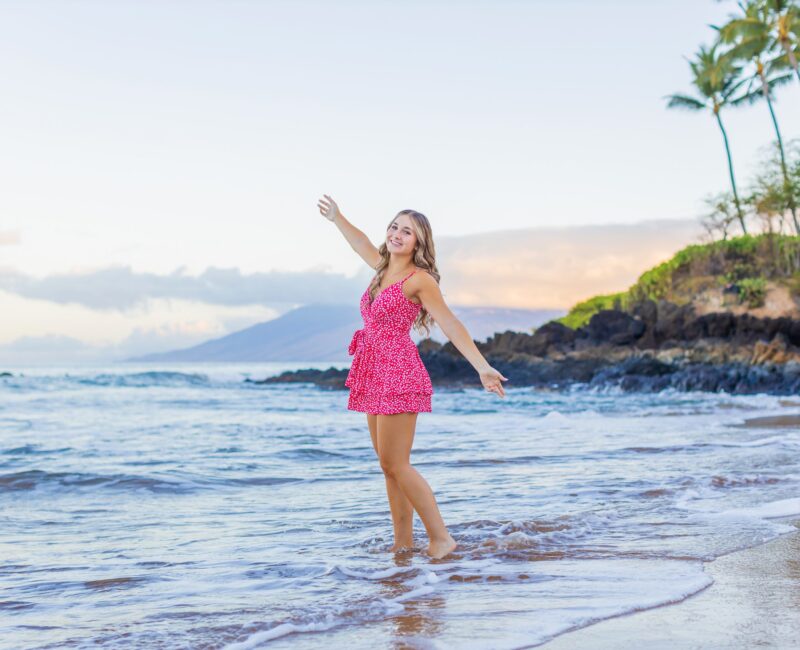 Maui graduate portraits – senior celebrating with ocean in background