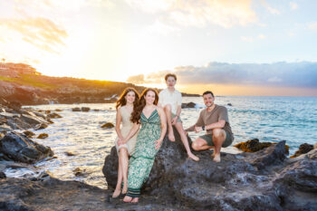 Family photoshoot in Maui – family posing on lava rocks ironwoods beach