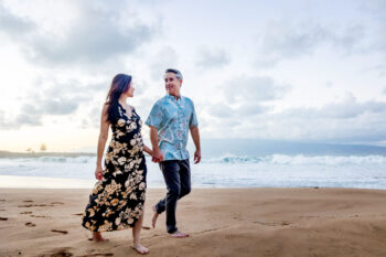 Engagement photoshoot Maui – couple kissing walking at DT Fleming Beach