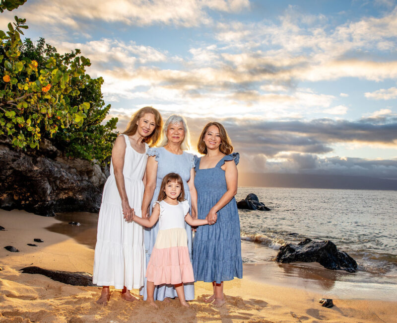 Family photoshoot in Maui – three generations lined up along the shoreline.