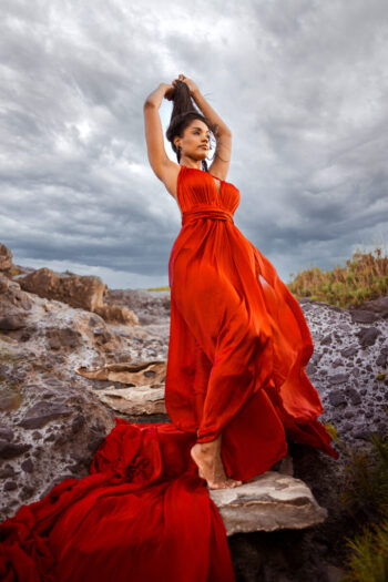 Flying dress photoshoot Maui – woman at cliffs
