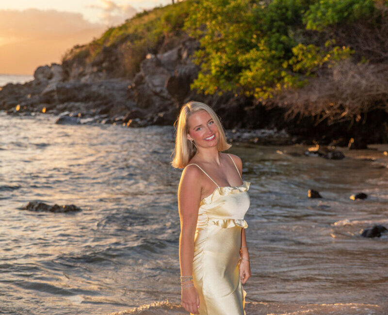Evening rocks and tide pools framing a coastal portrait, Maui.