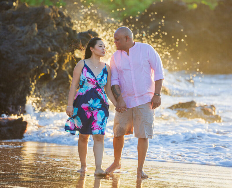 Engagement photoshoot in Maui – couple walking barefoot on the Maluaka Beach