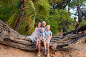 Maui family photo Session Poʻolenalena Beach Maui family photo session - dad and kids on driftwood.
