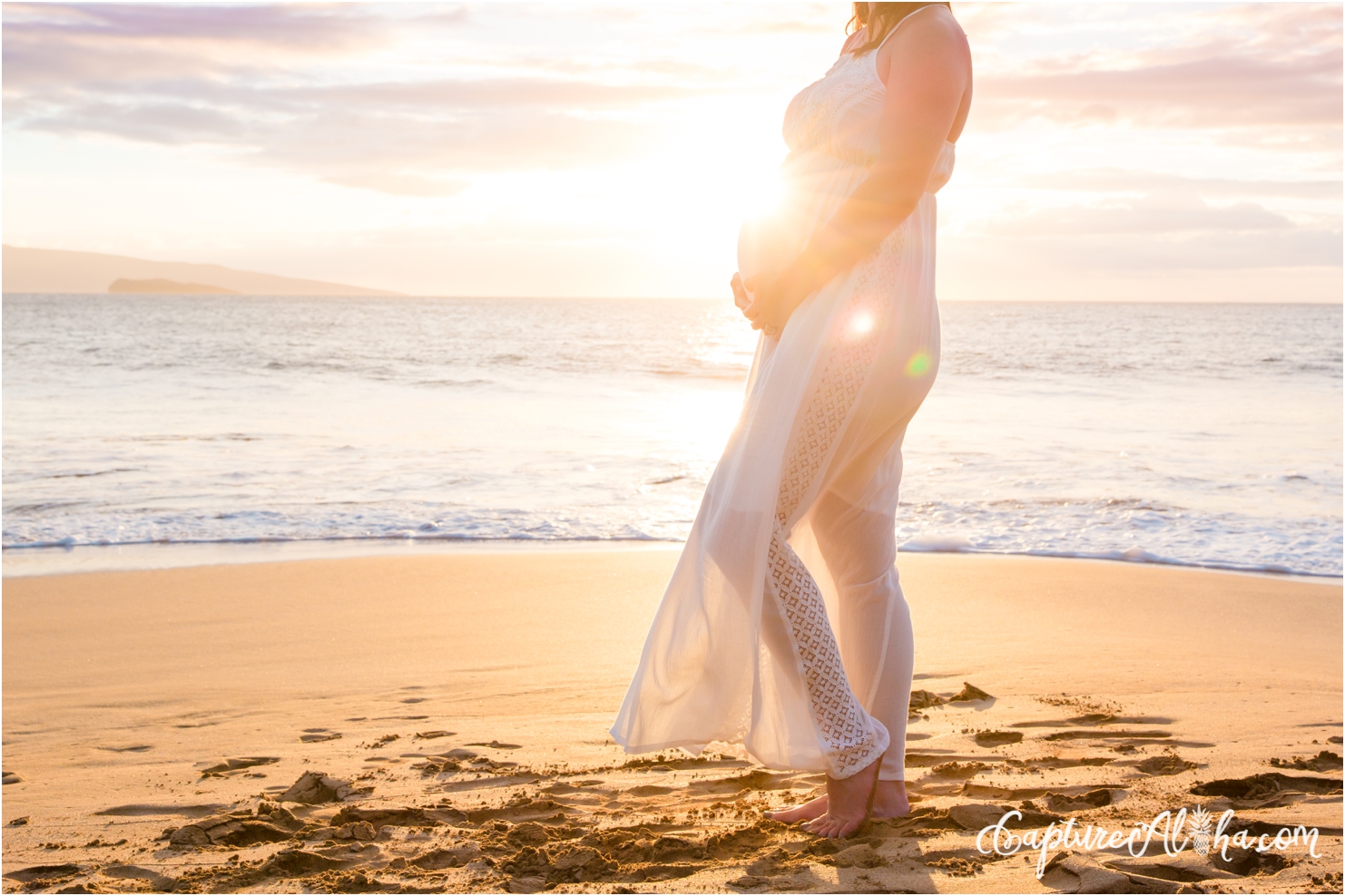 Maui maternity photography session at sunset in a white dress