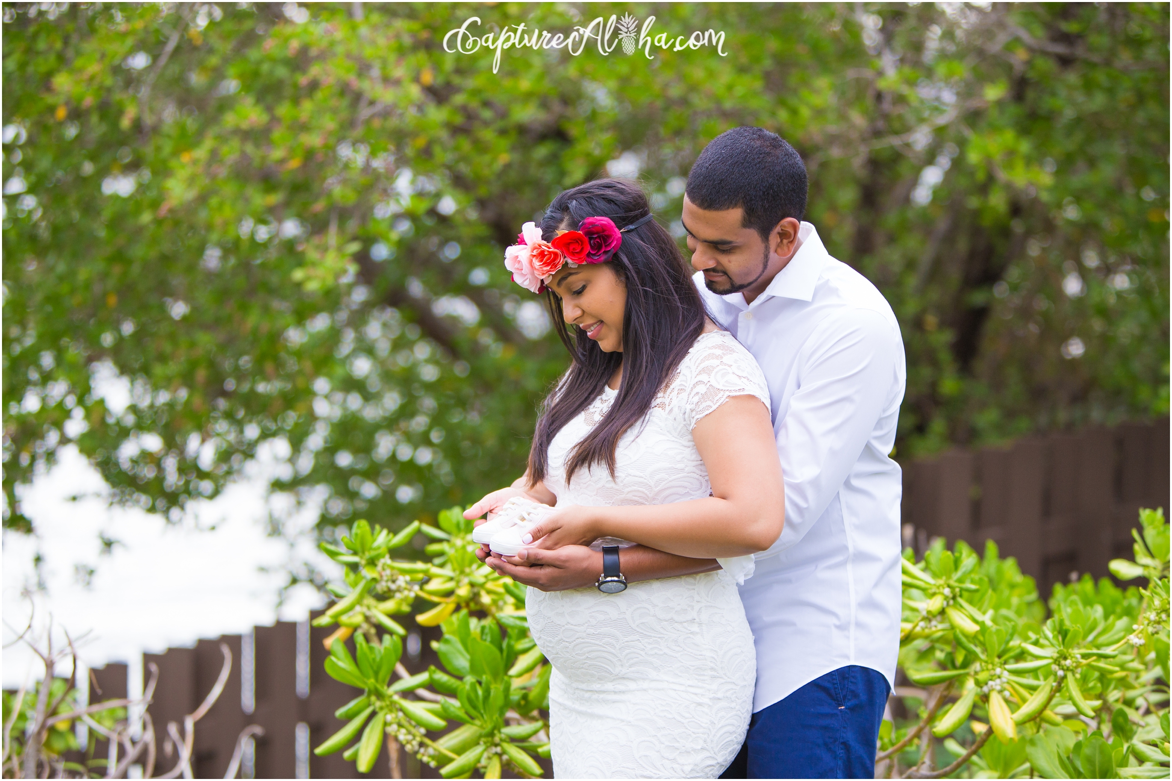 Maui Maternity Photography with couple wearing white and mom in a flower crown
