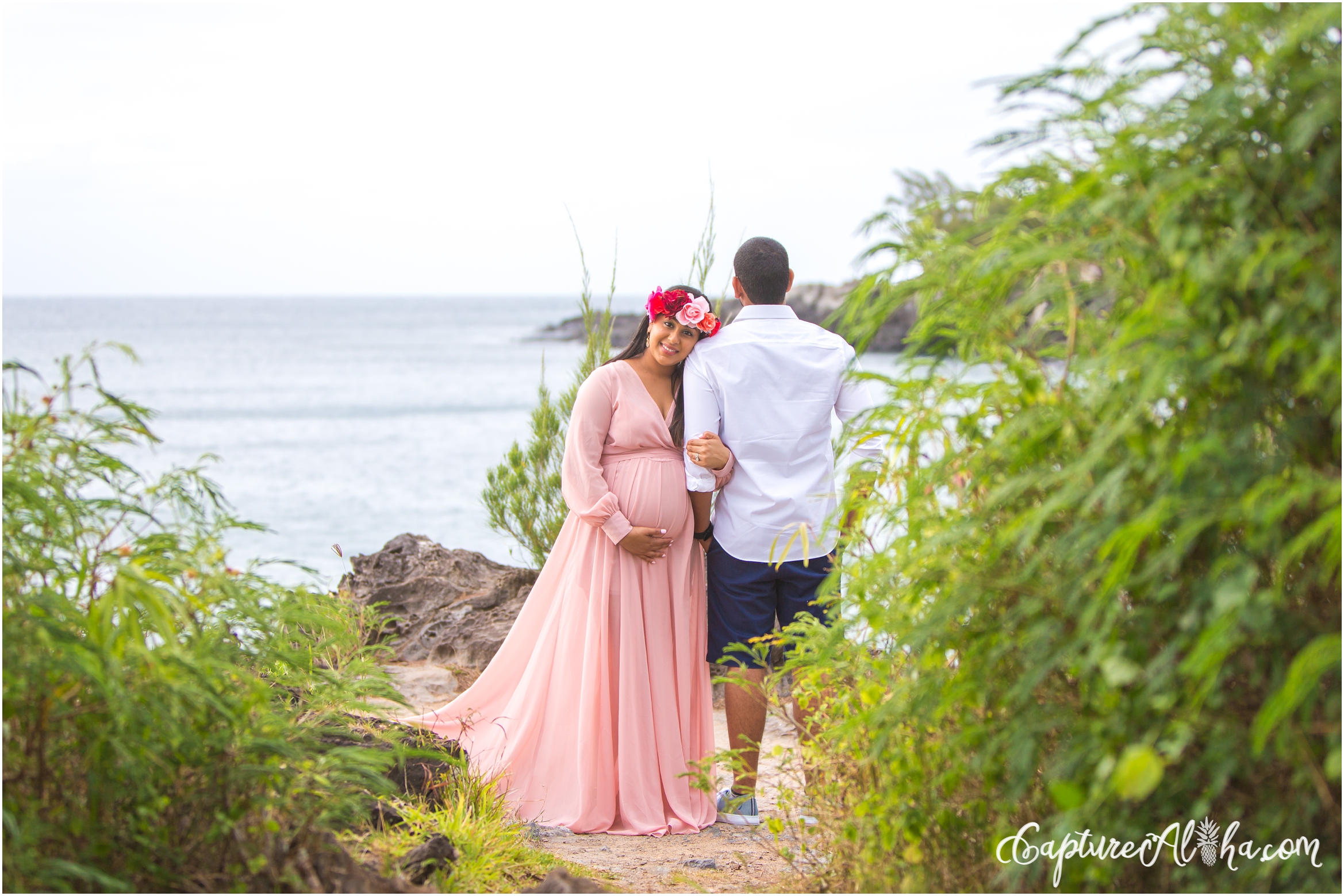 Maui Maternity Photography with couple wearing white and mom in a flower crown