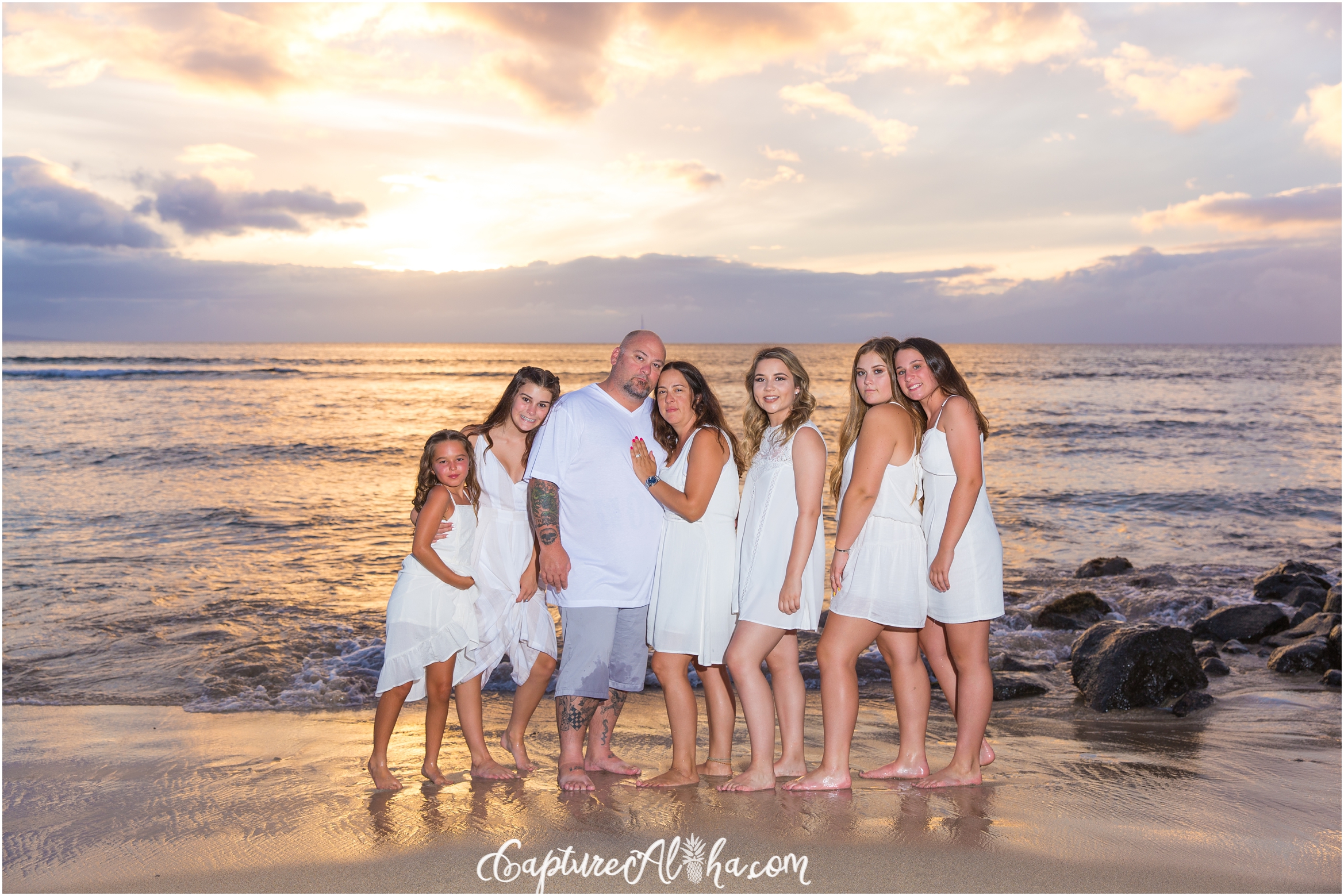 Maui Family Photography at Baby Beach in Lahaina by Mala Pier at sunset of family of 7 all dressed in white