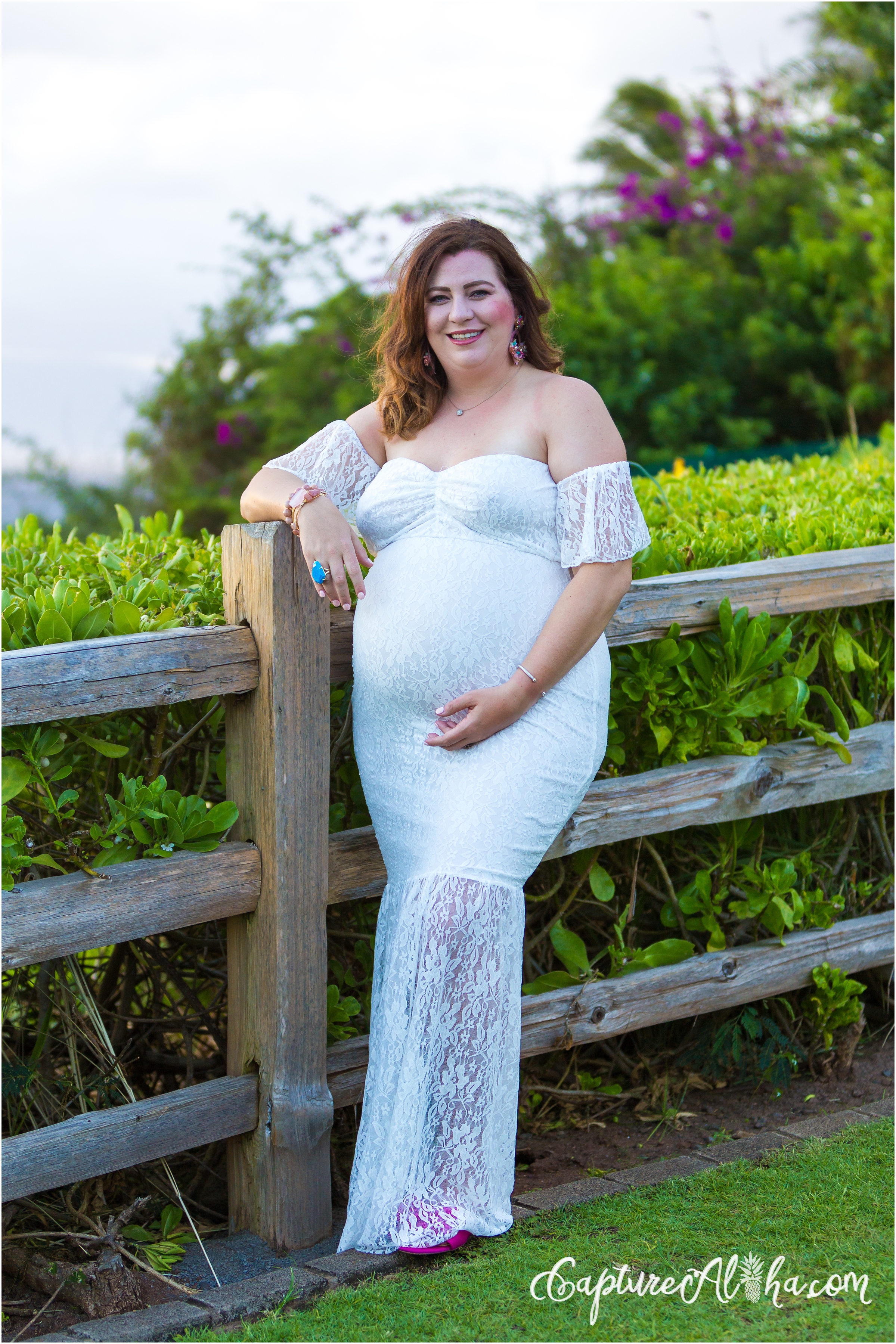 Maui Maternity Photographer at Kapalua Bay with Pregnant woman in a white dress in Maui
