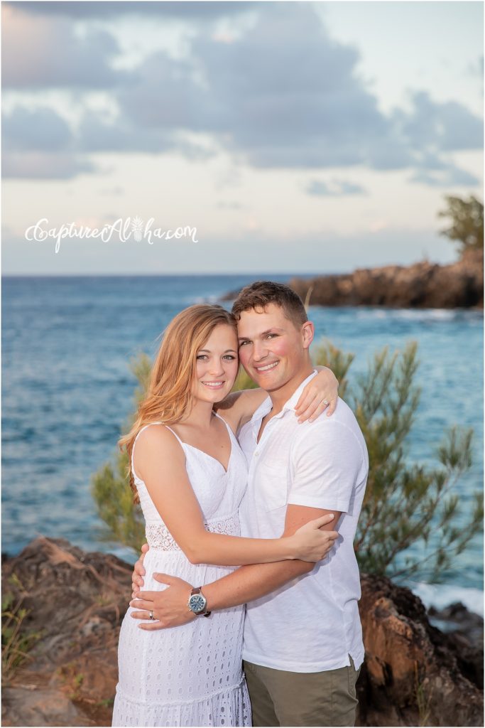 Engagement Photographer Maui with couple at kapalua bay beach on the rocks
