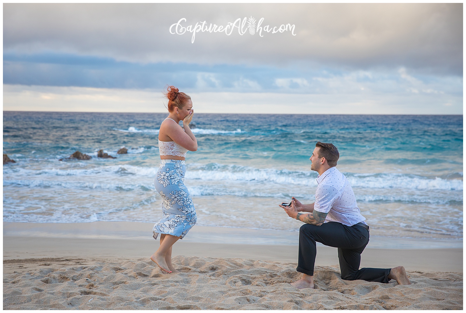 Maui Surprise Proposal Photography at Ironwoods Beach at Sunset, he's down on one knee