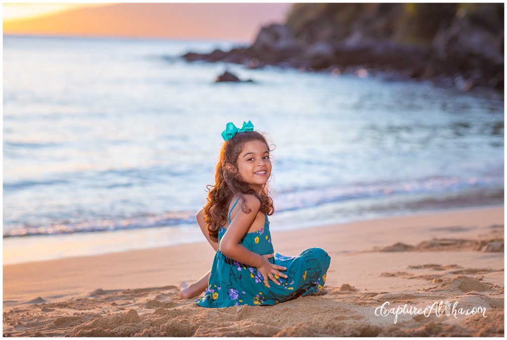 Maui Family Photography at Kapalua Bay Beach at sunset with a little girl in a blue dress