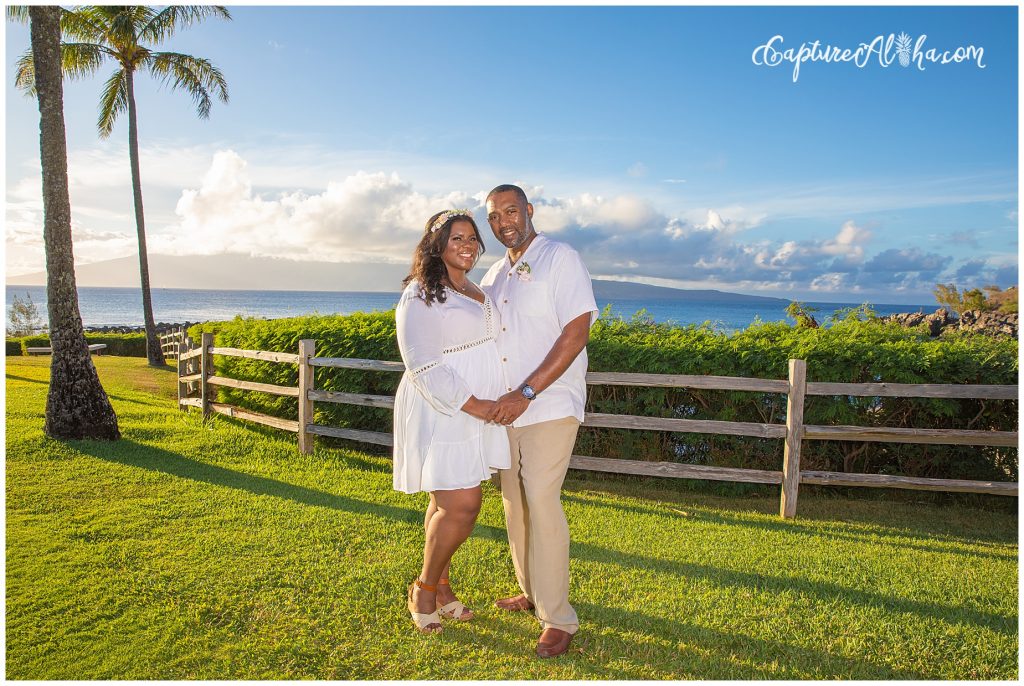 Maui Couples Photography at Kapalua Bay on the grass with palm trees