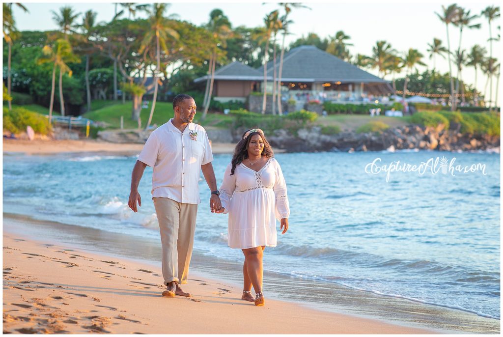 Maui Couples Photography on Kapalua Bay Beach with couple holding hands and walking down the beach