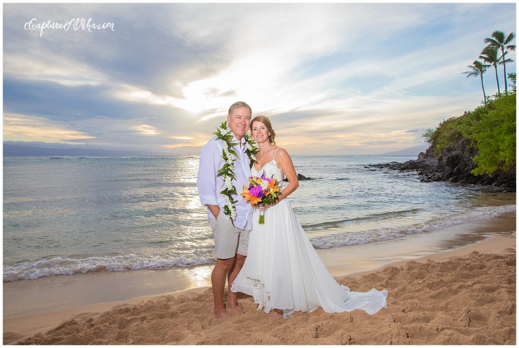 Wedding at The Cliff House Kapalua Bay bride and groom on the beach