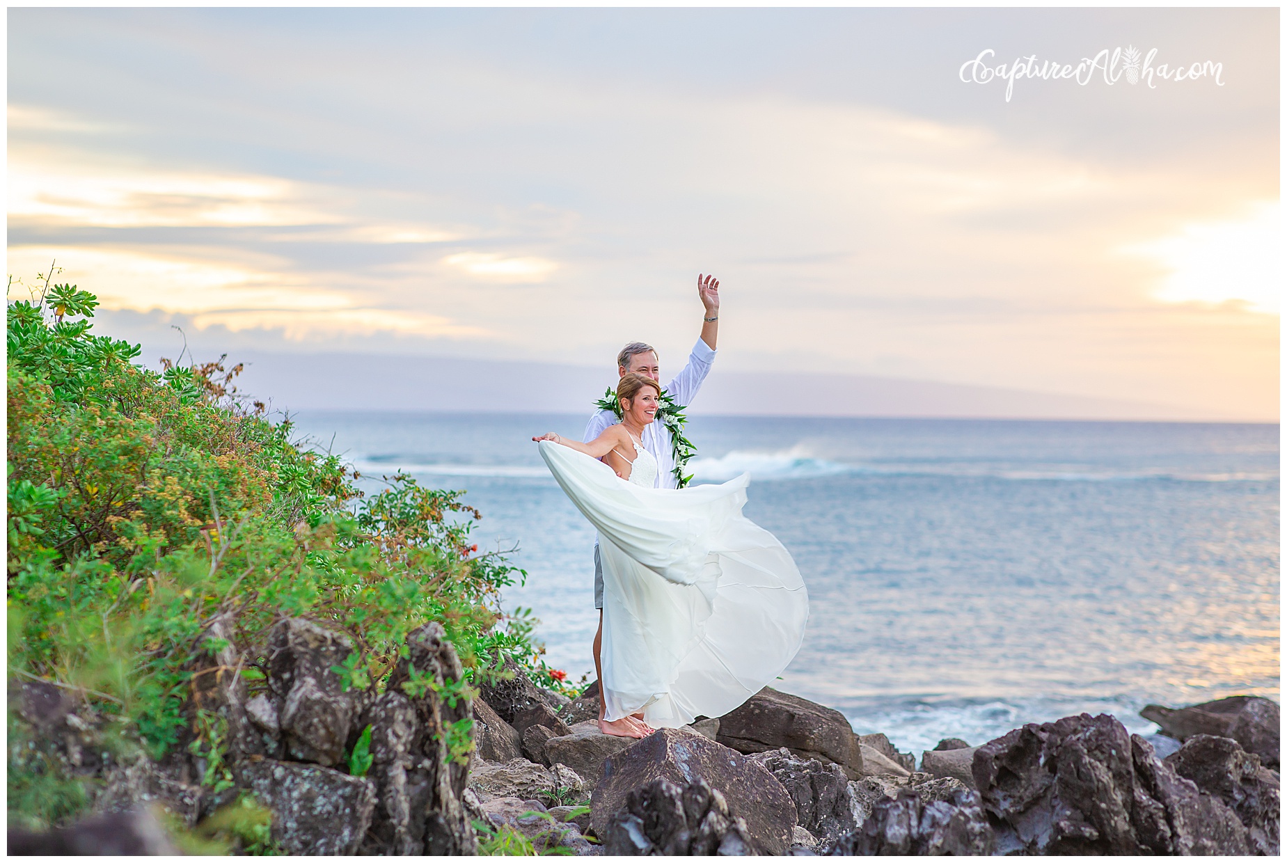 Wedding at The Cliff House Kapalua Bay bride and groom on the cliffs at sunset