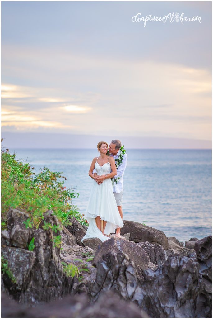 Wedding at The Cliff House Kapalua Bay bride and groom on the kapalua cliffs at sunset