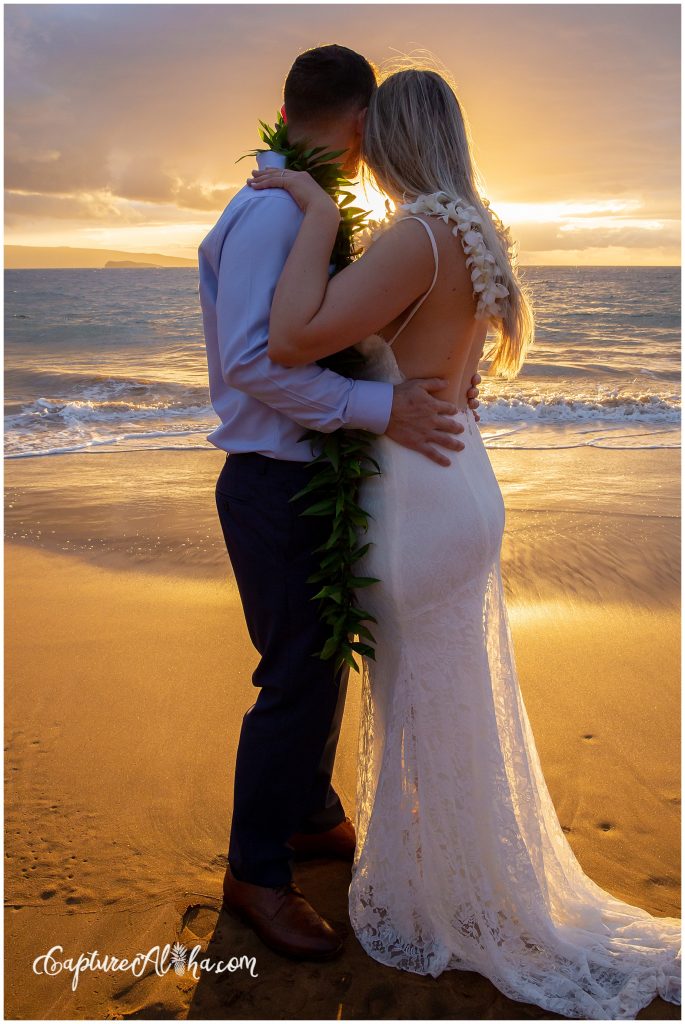 Maui Wedding Photography at Po'olenalena Beach, bride and groom watching the sunset