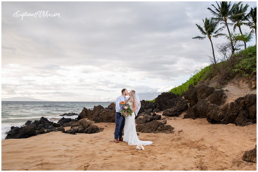 Maui Wedding Photography at Po'olenalena Beach, bride and groom first kiss