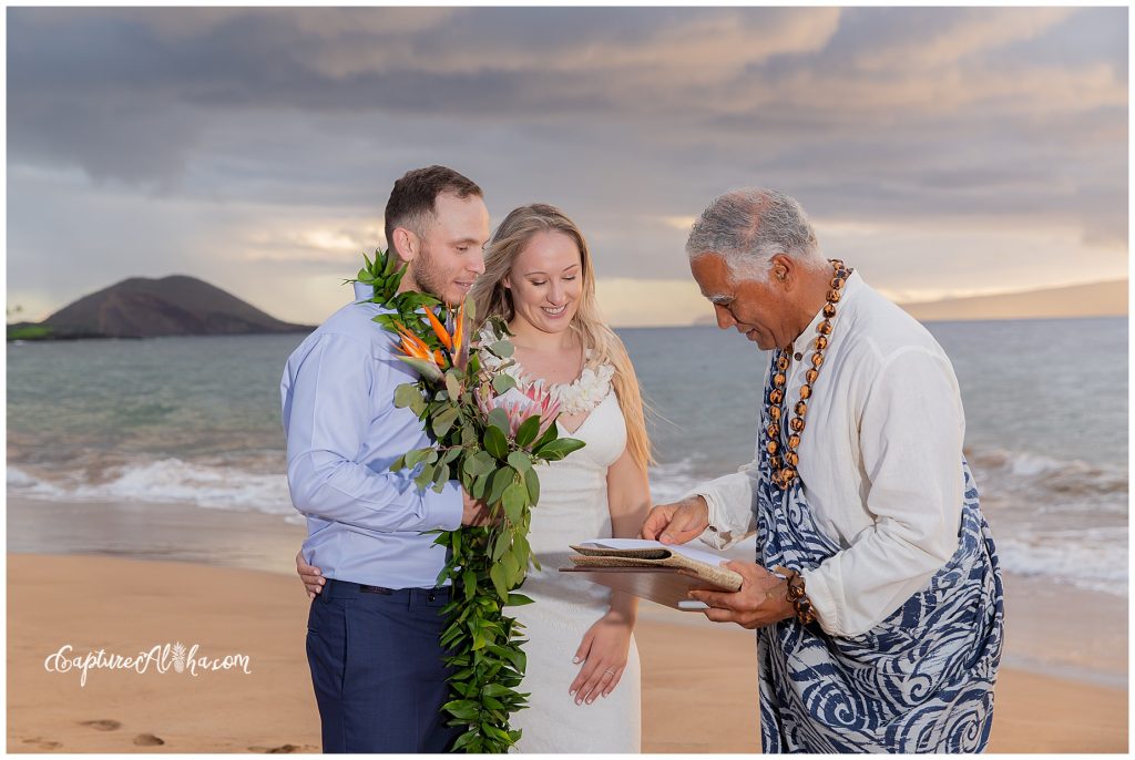 Maui Wedding Photography at Po'olenalena Beach, bride and groom signing marriage certificate