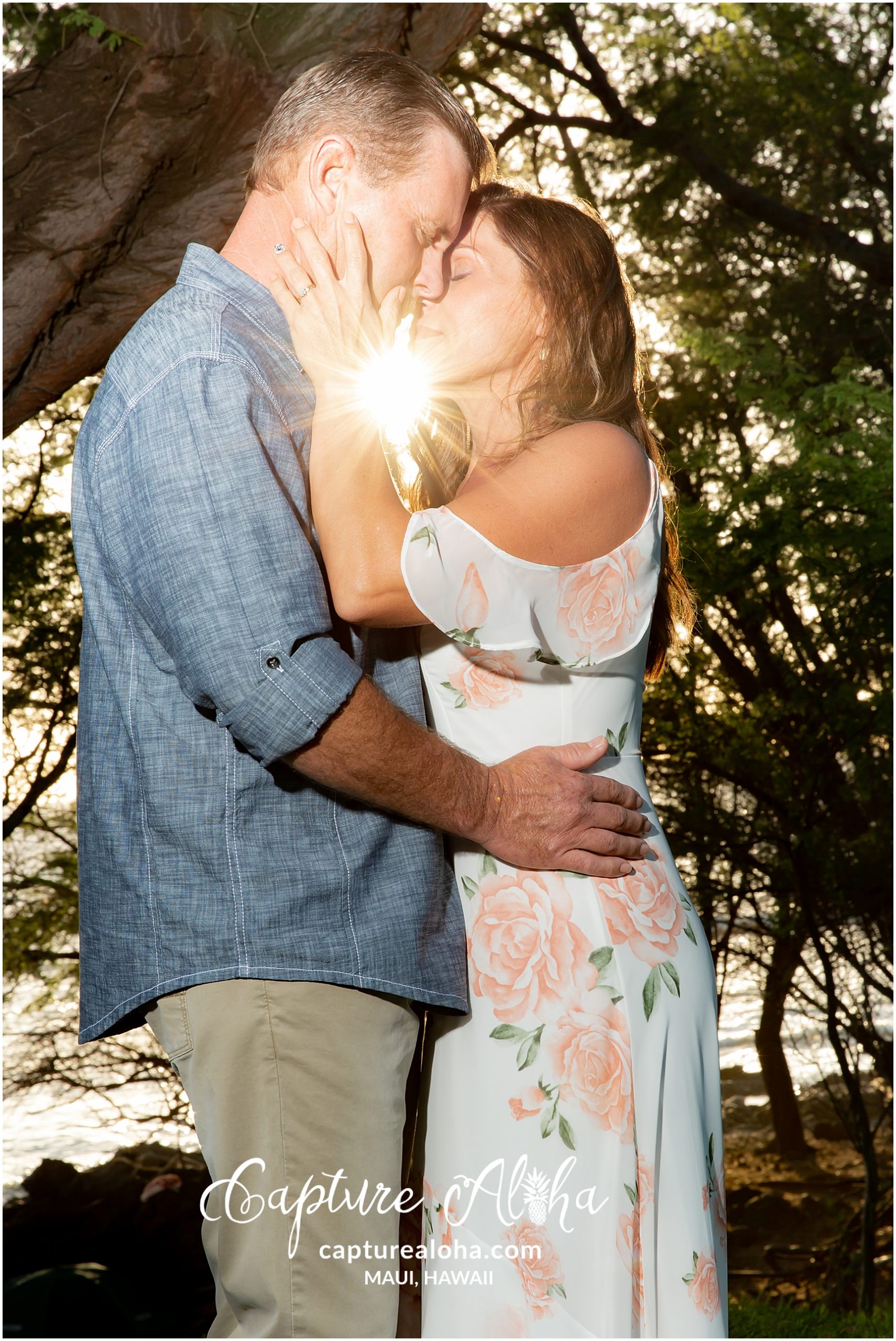 Maui Couples Photography at Mokapu Beach, Maui before sunset with couple kissing