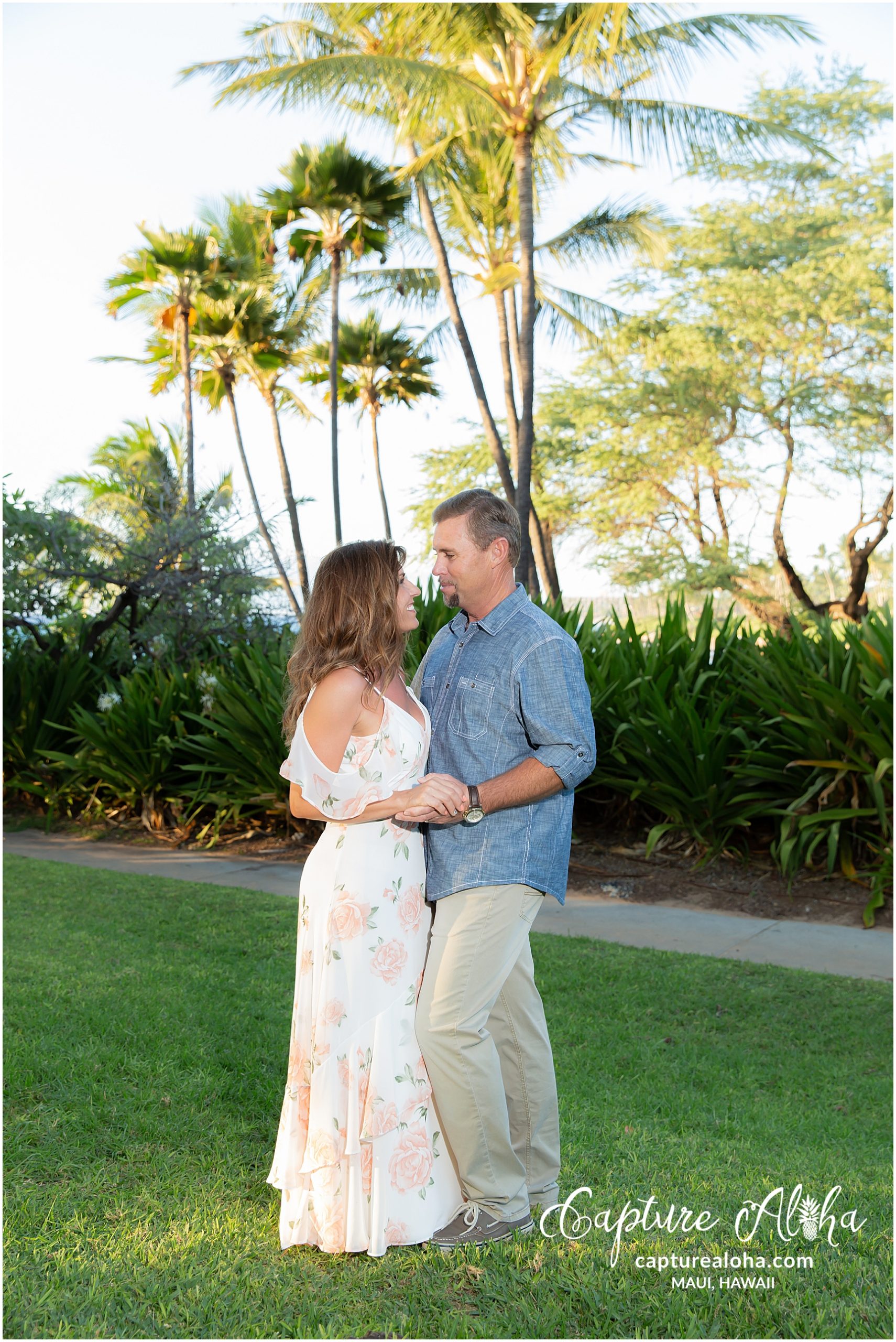 Maui Couples Photography at Mokapu Beach, Maui before sunset with palm trees in the background