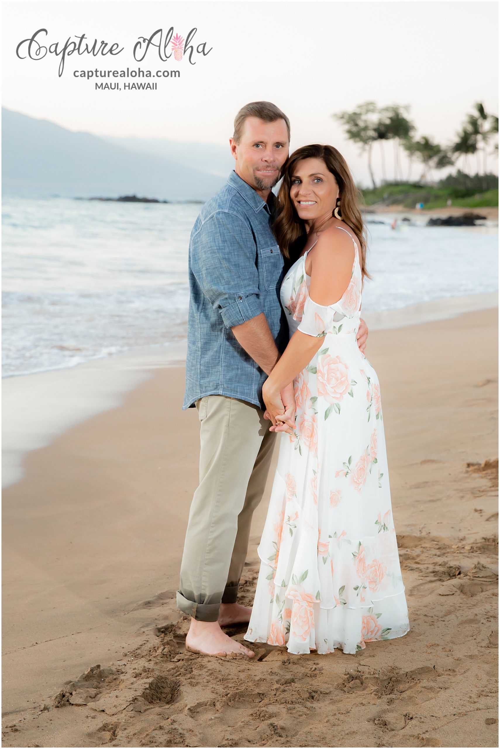 Maui Couples Photography at Mokapu Beach, Maui at sunset with couple holding hands on the beach